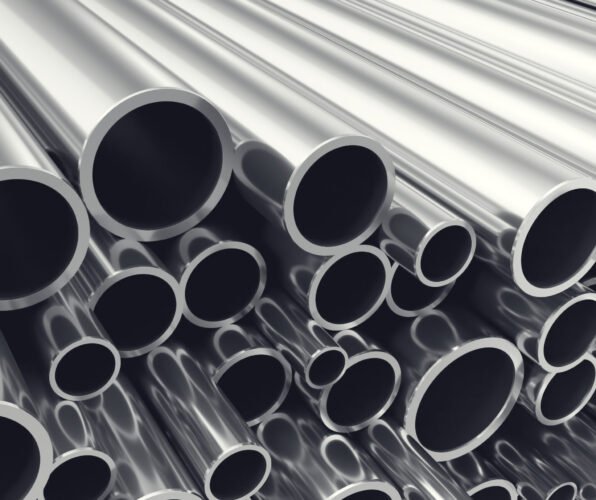 Heap of shiny metal steel pipes with selective focus effect, 3d illustration